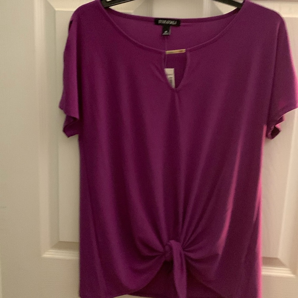New blouse with tags, size medium.